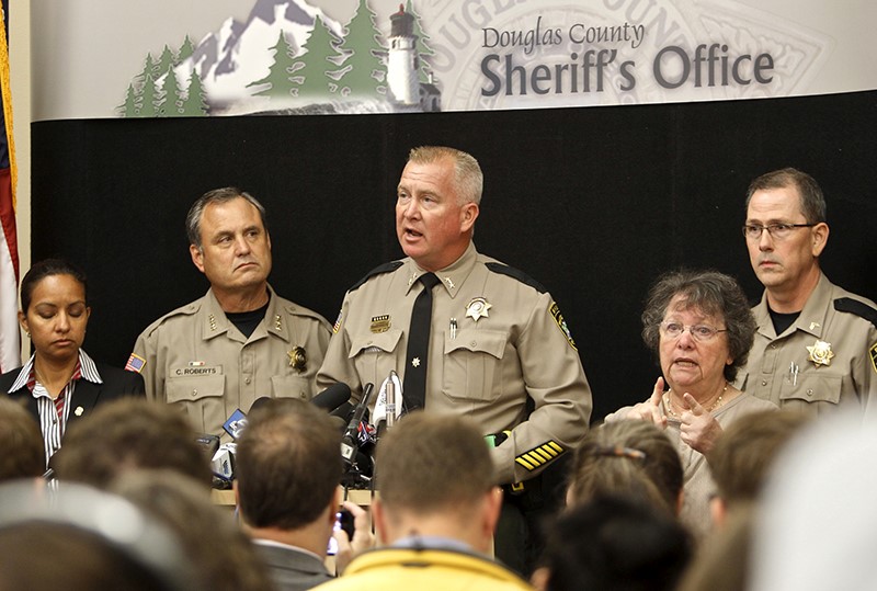Douglas County Sheriff John Hanlin, center, speaks at a news conference in Roseburg, Ore., on Oct. 2, 2015. Chris Harper Mercer, the man killed by police the previous day after he fatally shot nine people at a southern Oregon community college was a shy, awkward 26-year-old fascinated with shootings, according to neighbors, a person who knew him, news reports and his own social media postings. Steve Dipaola / Reuters